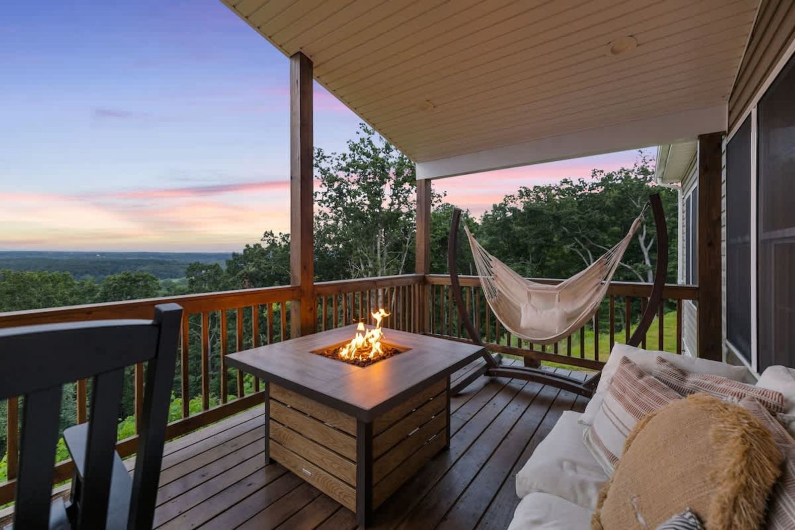 Propane fire pit and hammock on the deck at golden hour