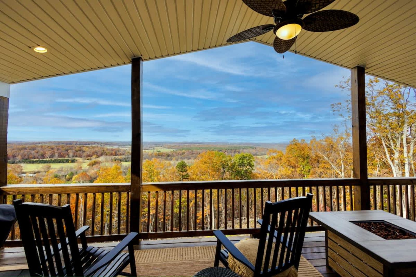 Autumn view from the covered porch with ceiling fans and a fire pit